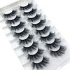 Un ensemble de huit paires de faux cils de renard de luxe dans un plateau en plastique blanc.