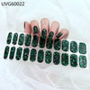 A hand displays various black and green glitter UV gel nail stickers for full coverage decals.