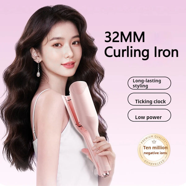 A woman is holding a pink 32MM curling iron for hair styling.