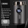A close-up view of a black electric shaver with a silver cap and a digital display showing 99, next to a charging cable.