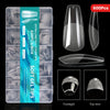 A box of 600 clear acrylic nail tips for fingers and toes, including various shapes like almond and coffin.