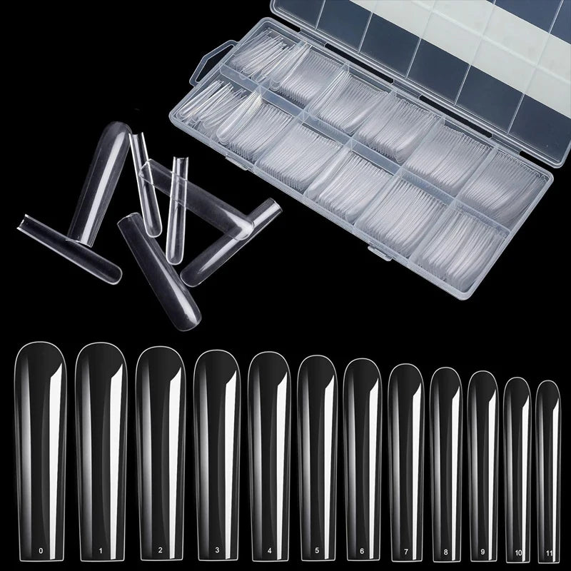 A collection of clear square press-on fake nails displayed alongside an open storage case.