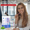 A woman holds a disposable waterless toothbrush and several toothbrushes in an office setting.
