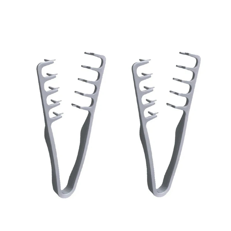 A pair of metal hair styling combs with wide teeth for volumizing hair.