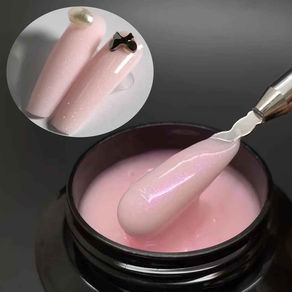 Un constructeur de gel de milieu rose auto-nivelant pour extensions de ongles, présenté dans un pot avec une spatule cosmétiq