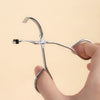 A hand is holding a stainless steel wide-angle eyelash curler, demonstrating its use.