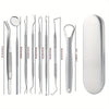 A set of professional multi-tool tooth cleaning instruments including various sized probes and a cleaning disc.