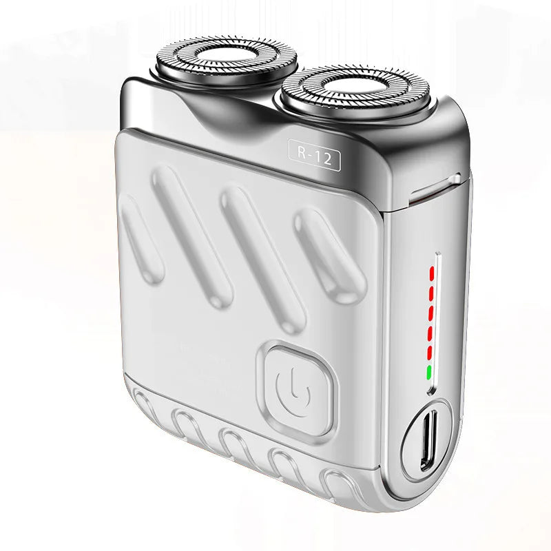 A silver magnetic electric shaver for men with a rotating head and power switch visible.