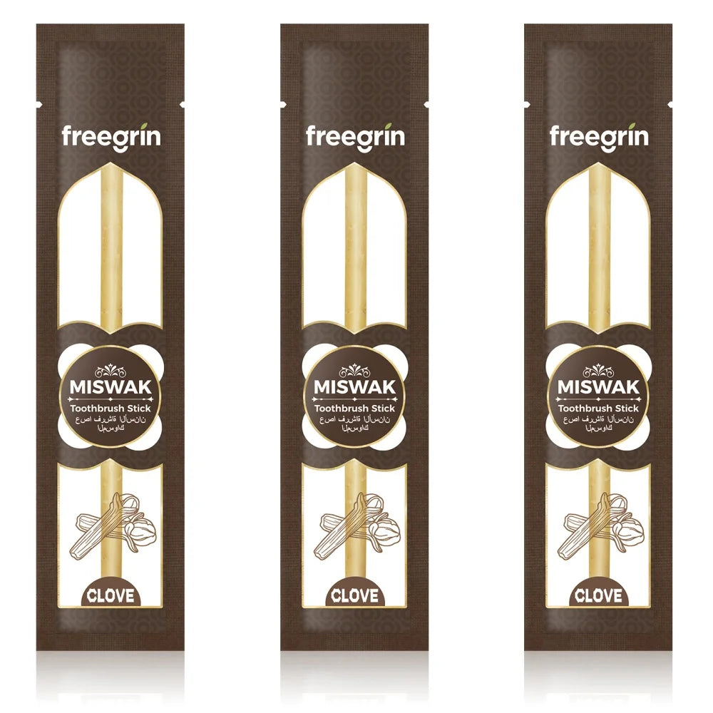 Three packages of freegrin Miswak toothbrush sticks with clove flavor.