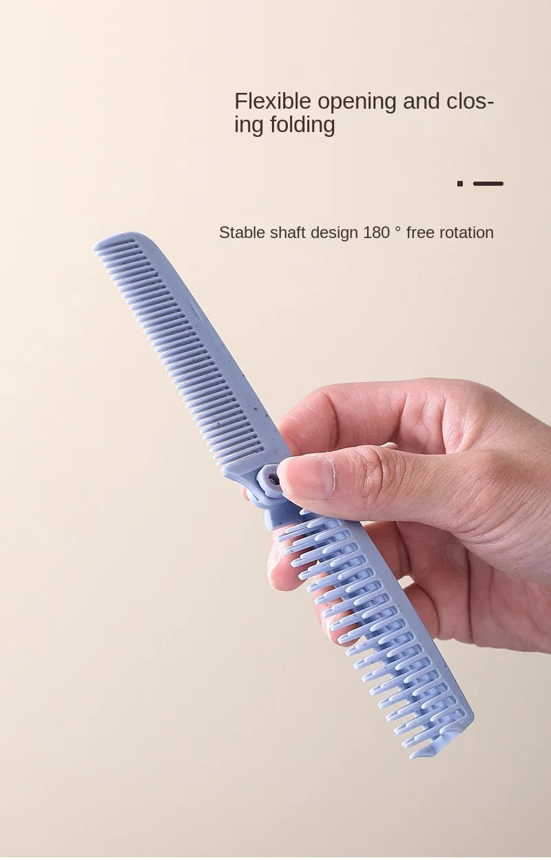 A hand holds a light blue portable folding hairbrush with anti-static bristles, demonstrating its flexible opening and closin