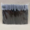 Un sac en plastique transparent contenant un ensemble de ciseaux à sourcils de précision avec des poignées sombres et des pro