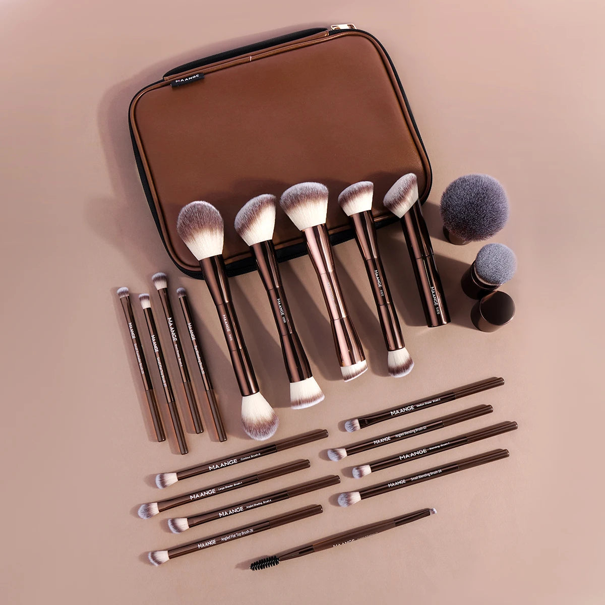 A brown makeup brush set with various sizes and a travel case is displayed on a light background.