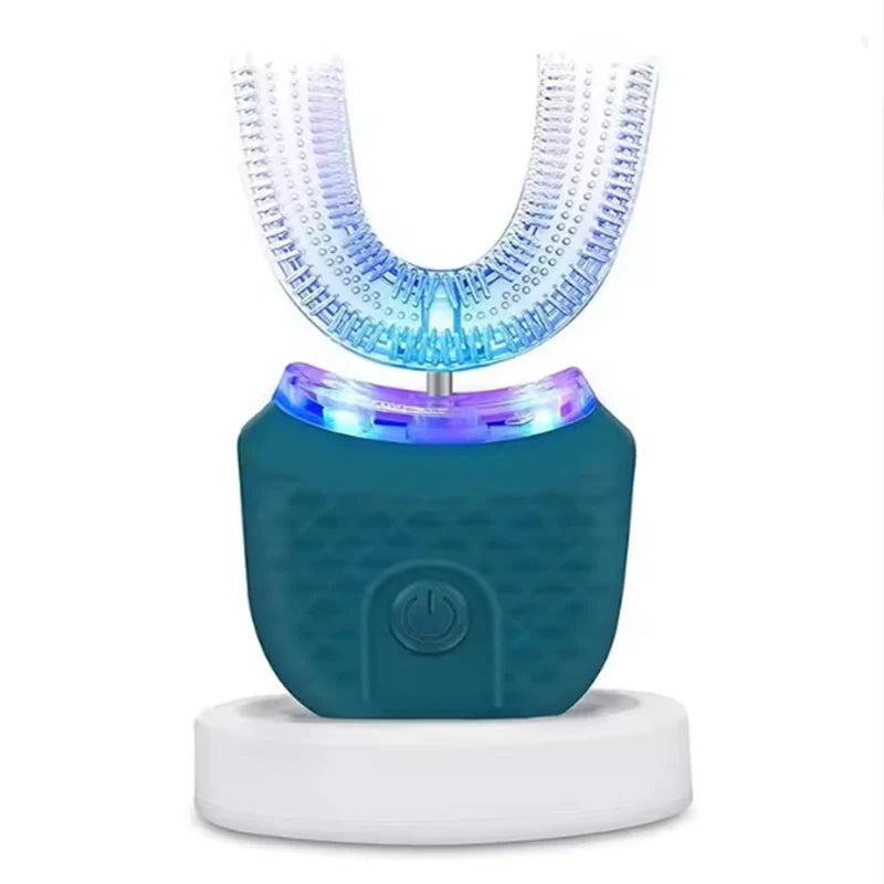 A teal ultrasonic electric toothbrush with a clear head and white base sits on a white platform.