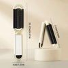 A white folding pocket hair comb with a mirror and scalp massage cushion shown vertically.