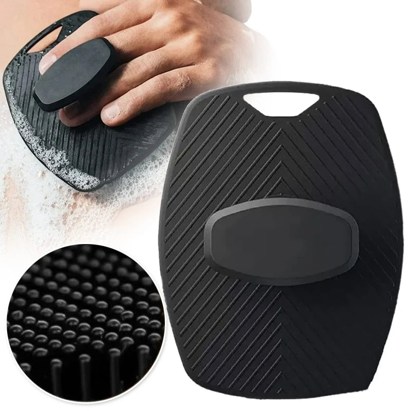 A black silicone body scrubber is shown being held by a hand, with a close-up view of the textured surface.