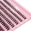 Close-up of a pink lash tray with several rows of black cluster lashes.