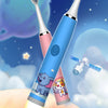 A children's electric toothbrush with a blue handle and pink accents is shown against a starry night sky with planets and clo