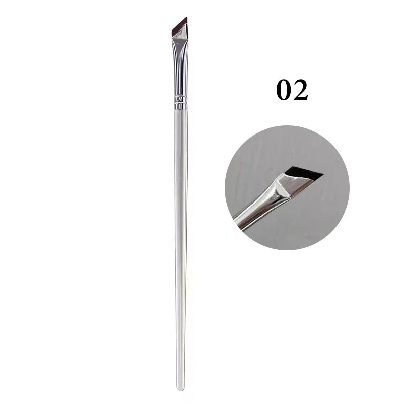 A long, thin, silver angled eyeliner brush with a pointed tip.