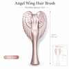 Rose gold angel wing hair brush with a tapered handle and detailed feather design