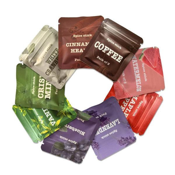 A collection of various spice stick essential oil packs including cinnamon heat coffee lavender and peppermint
