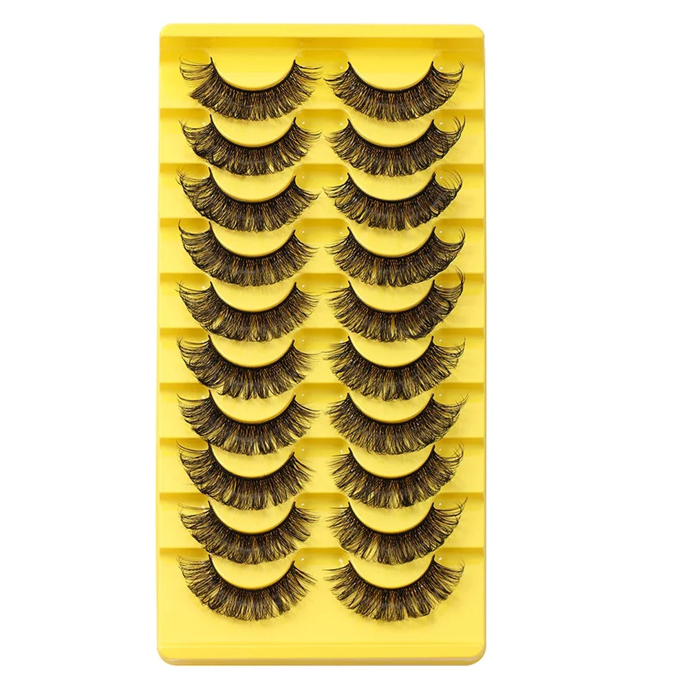 A yellow plastic tray holding multiple rows of black false eyelashes.