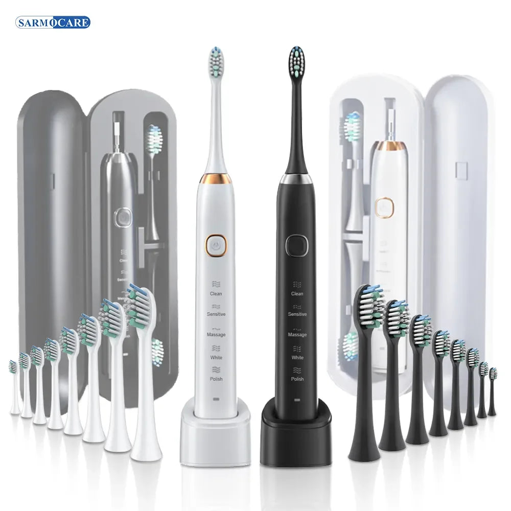 Un set de cepillos de dientes sónicos blancos y negros con varias cabezales expuestos en su empaque.
