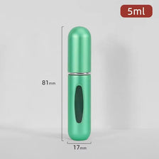 A vertical shot of a mint green refillable perfume bottle with a silver pump, showing its dimensions.