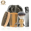 A set of boar bristle beard brush and comb with a gift bag displayed on a white surface.