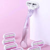 A set of three replacement shaving blades with white and pink accents displayed against a white background.