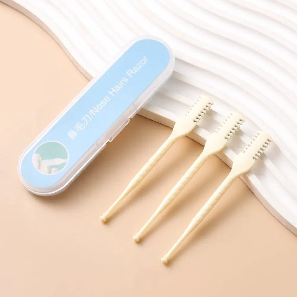 A clear plastic case holds four wooden double-sided nose hair razors resting on a light beige surface.