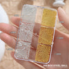 A clear six-box case of gold mixed stainless steel beads for nail art decorations shown in a hand.