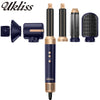 A set of Ulkiss hair styling tools including a dryer brush, curling iron, and straightener in dark blue and gold.