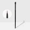 A single black professional angled makeup brush standing vertically against a light gray background.