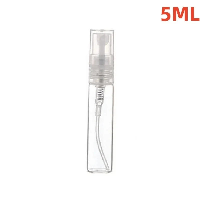 A clear glass perfume bottle with a white pump dispenser and a silver-colored neck, labeled 5ML.