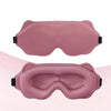 Ein Paar rosa 3D-konturierte Schlaf-Augenmasken, gezeigt aus oberer und frontaler Ansicht.