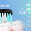 A black toothbrush with multiple light blue bristles is shown cleaning a white tooth model.