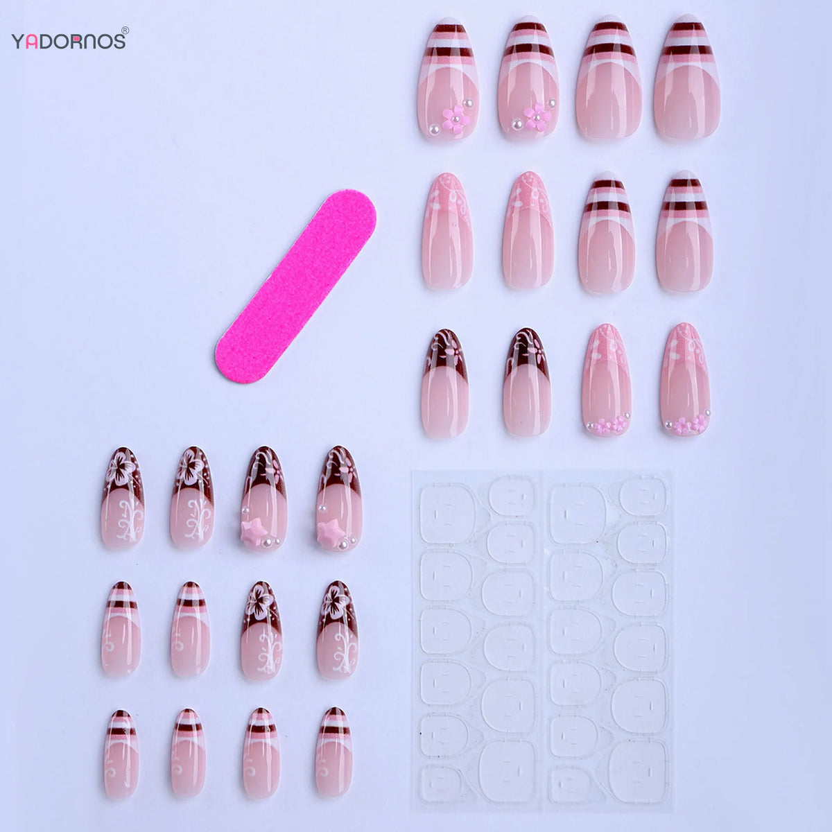 A set of pink press-on nails featuring flower and star designs displayed on a white background.