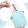 A hand holds a light blue pouch containing instant iodine swabs for wound care and hygiene.