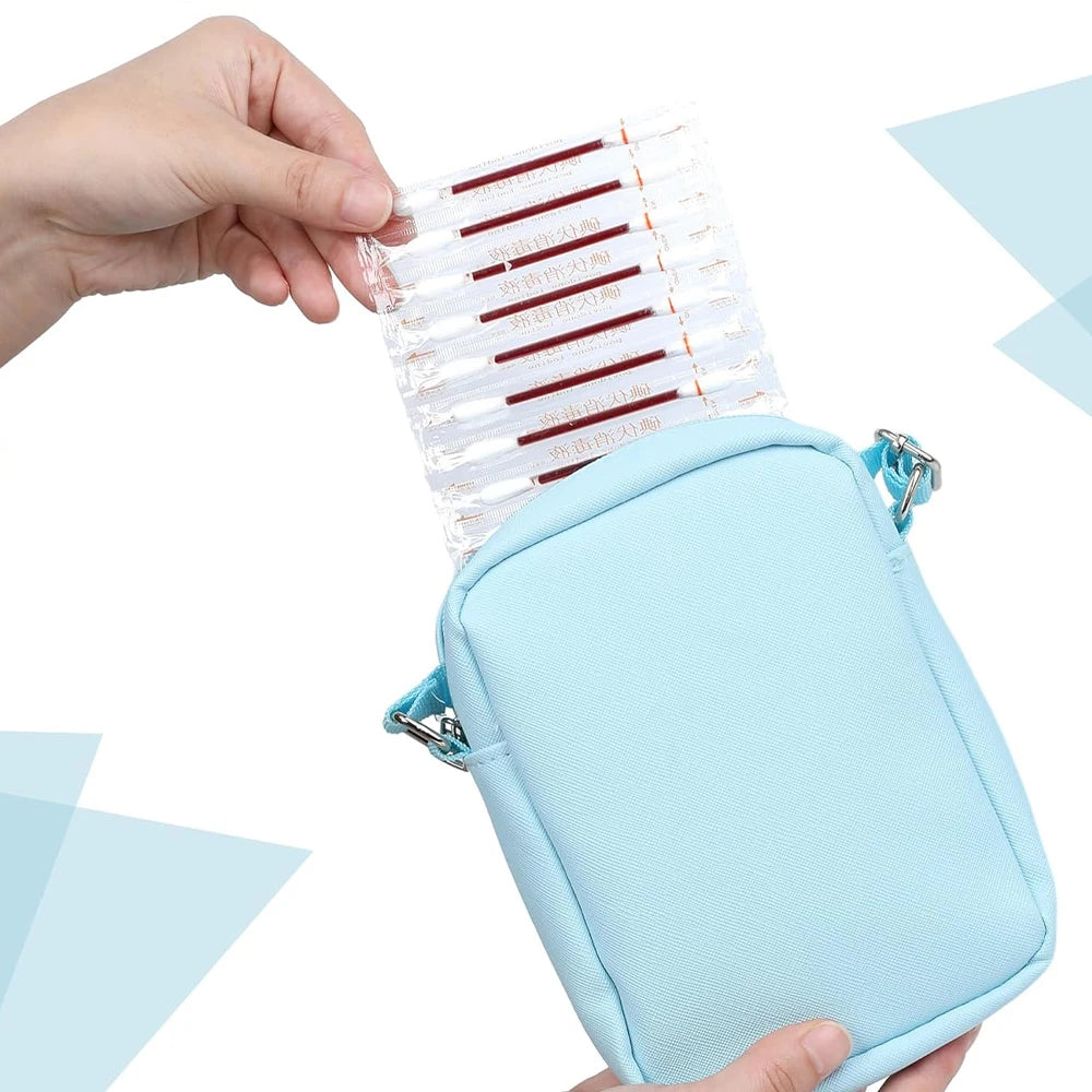 A hand holds a light blue pouch containing instant iodine swabs for wound care and hygiene.