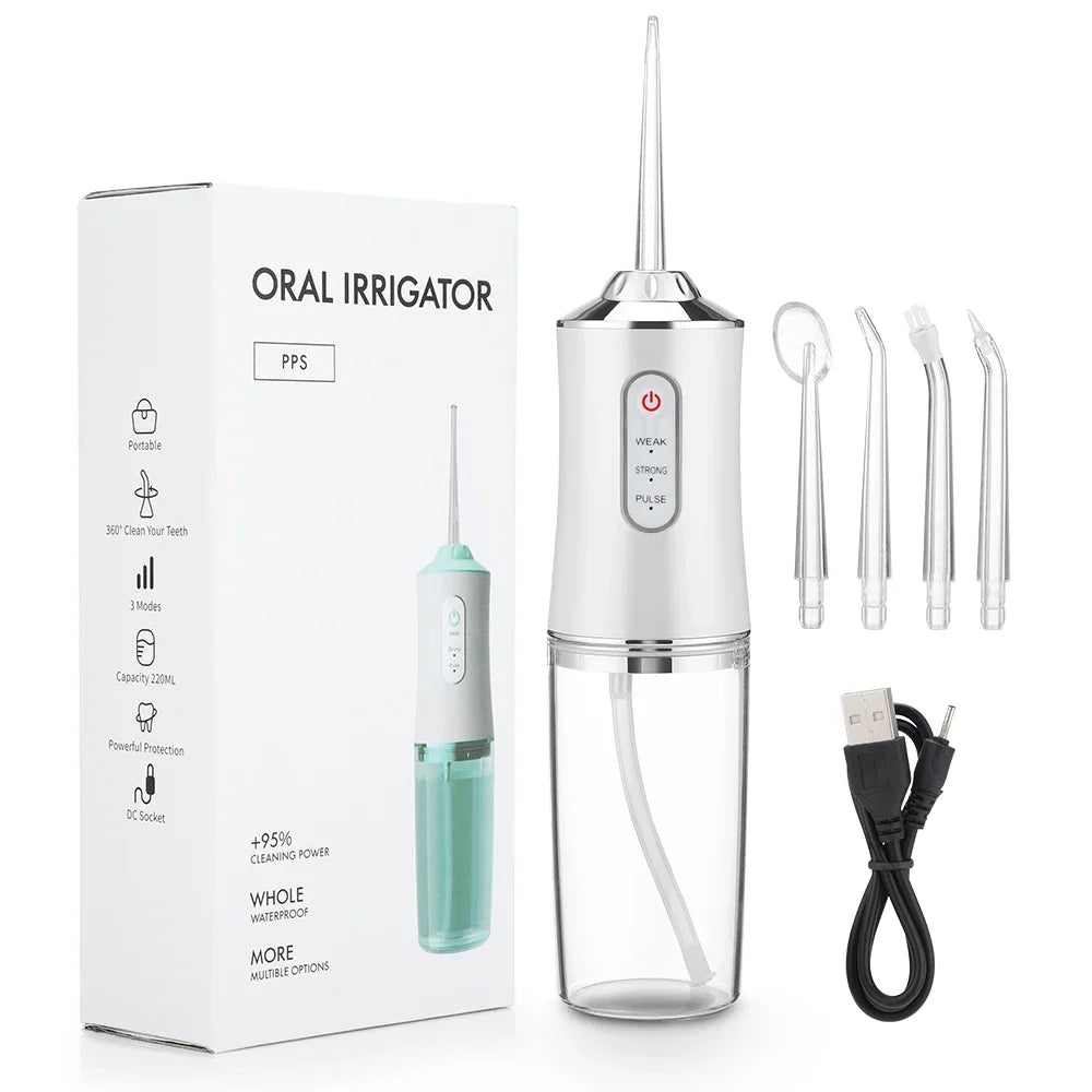 A portable oral irrigator device in silver and green is shown with its cleaning tube and charging cable.