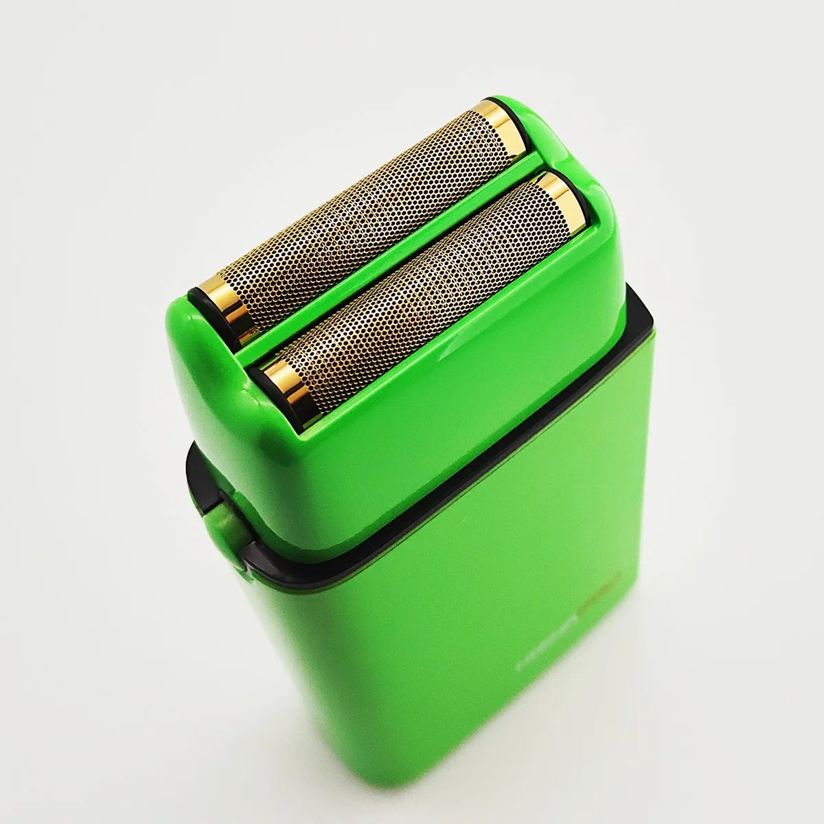 A bright green professional high-speed hair trimmer set with metallic accents.