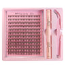 A pink tray holding numerous lash extensions and tools for DIY lash application.