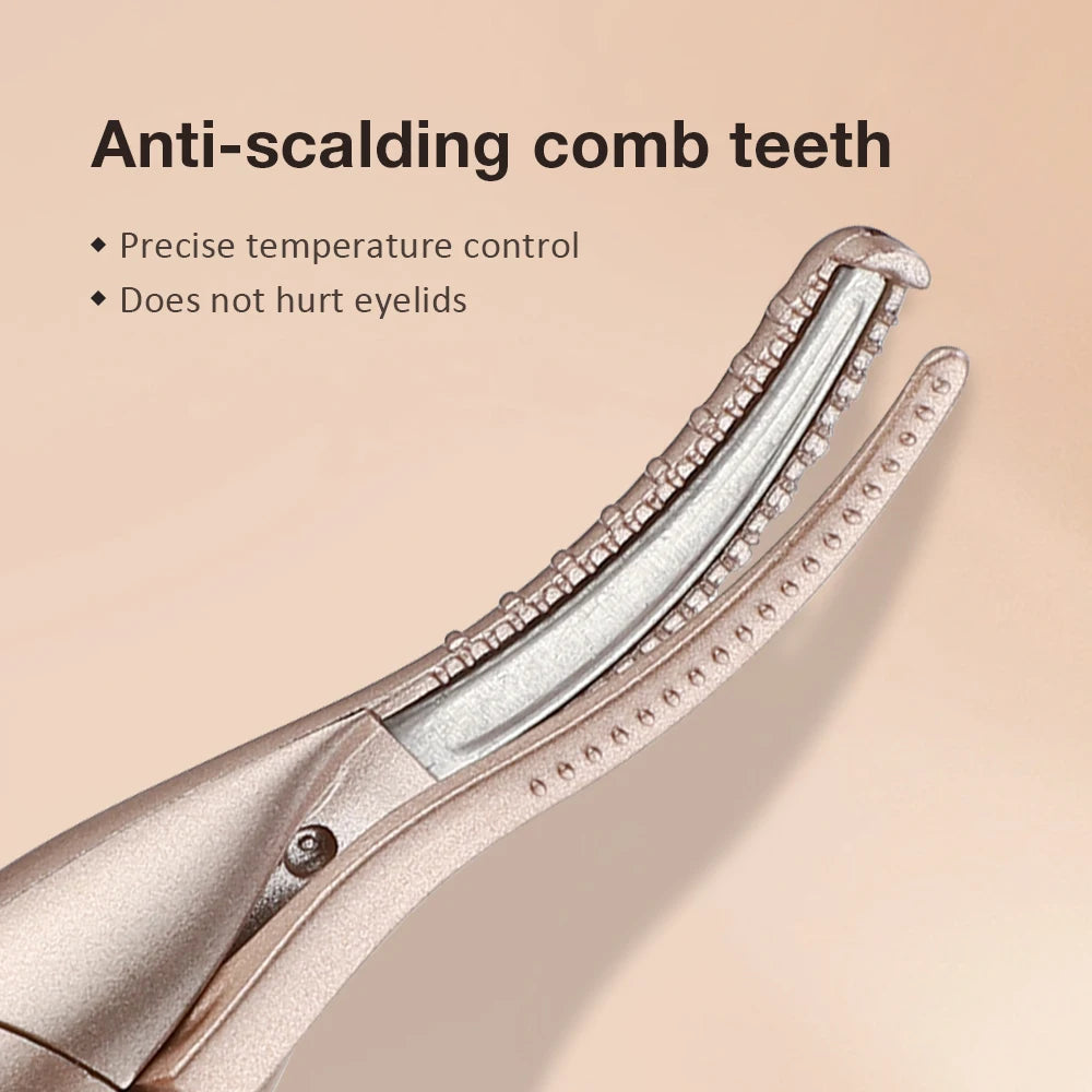 Close-up of a rose gold electric comb tool used for eyelash curling and eyebrow trimming.
