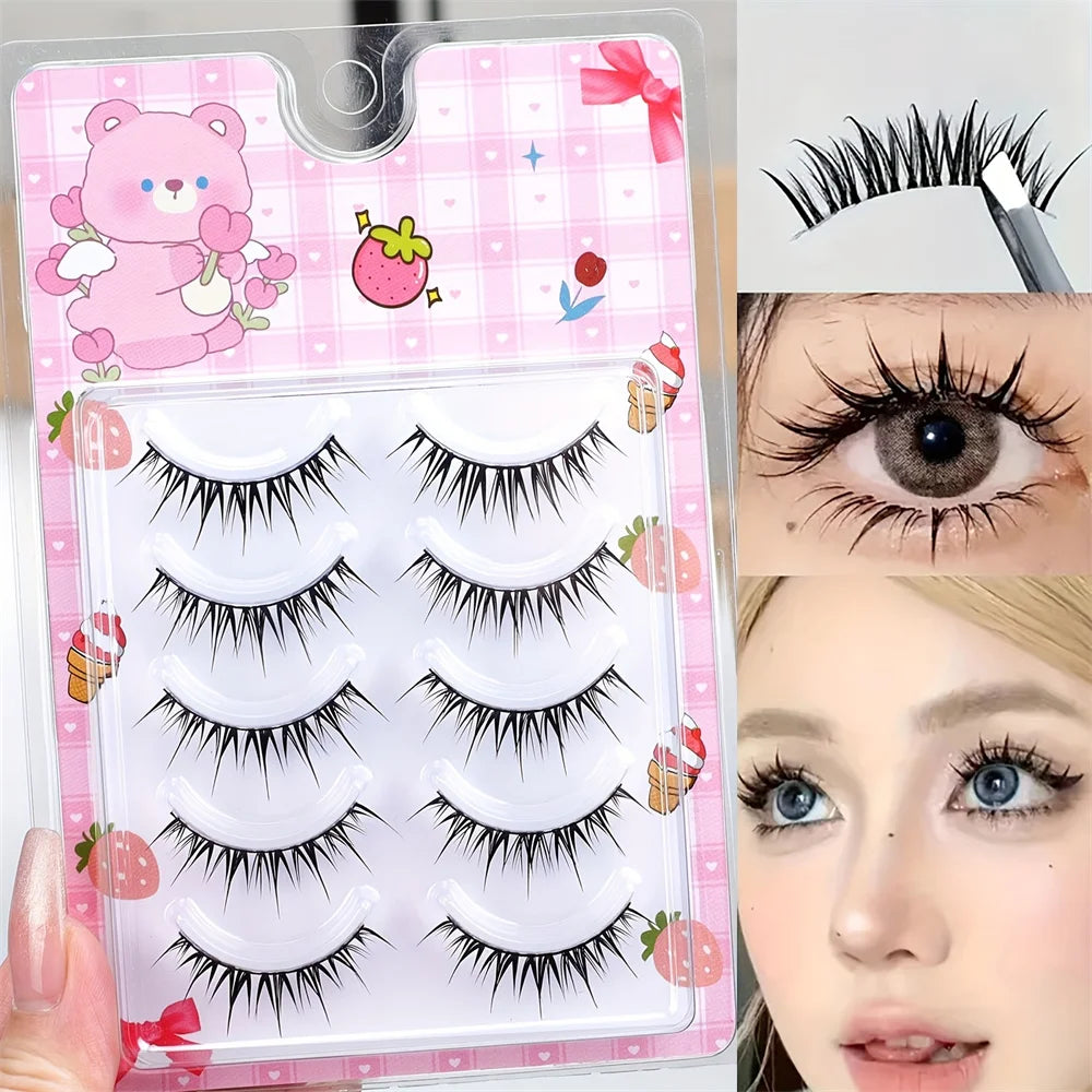 A clear plastic storage case containing five pairs of black strip eyelashes for an eye lash application.