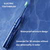 A blue electric toothbrush immersed in water, highlighting its waterproof structure design.
