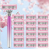 A pink and silver professional safety razor with multiple blades displayed against a soft pink cherry blossom background.