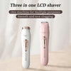 A pink and white LCD shaver shown in a vertical orientation on a light wooden surface.
