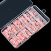 A clear acrylic case filled with nude pink press-on nails featuring white French tips.