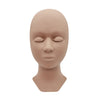 A realistic silicone mannequin head used for practicing eyelash extensions.