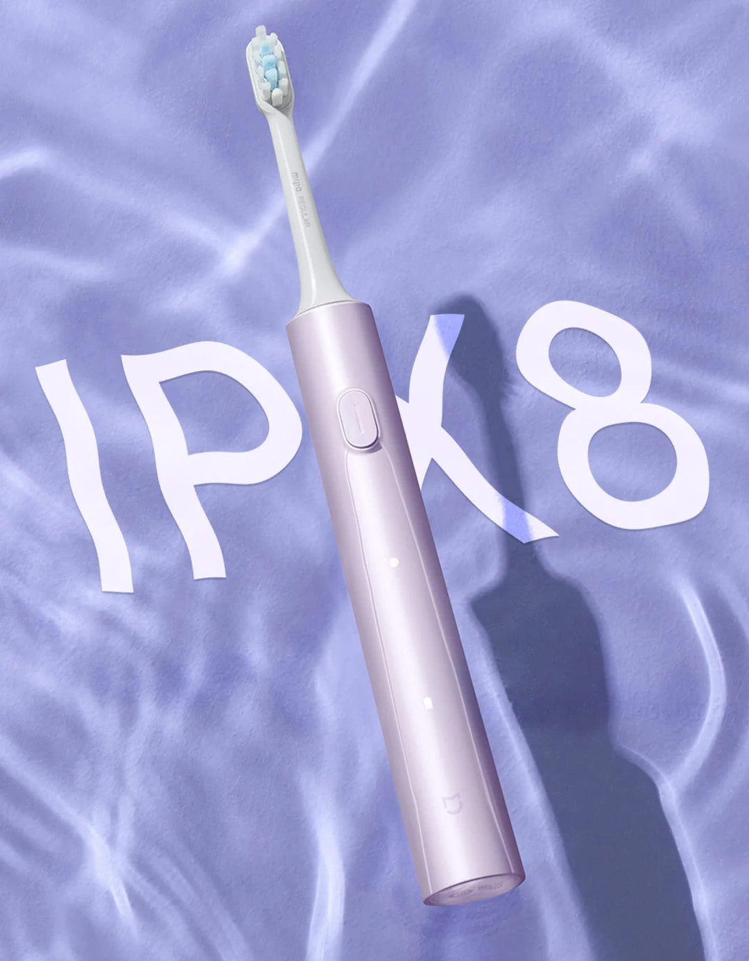 A pink sonic electric toothbrush with a white brush head is shown against a light purple, watery background.